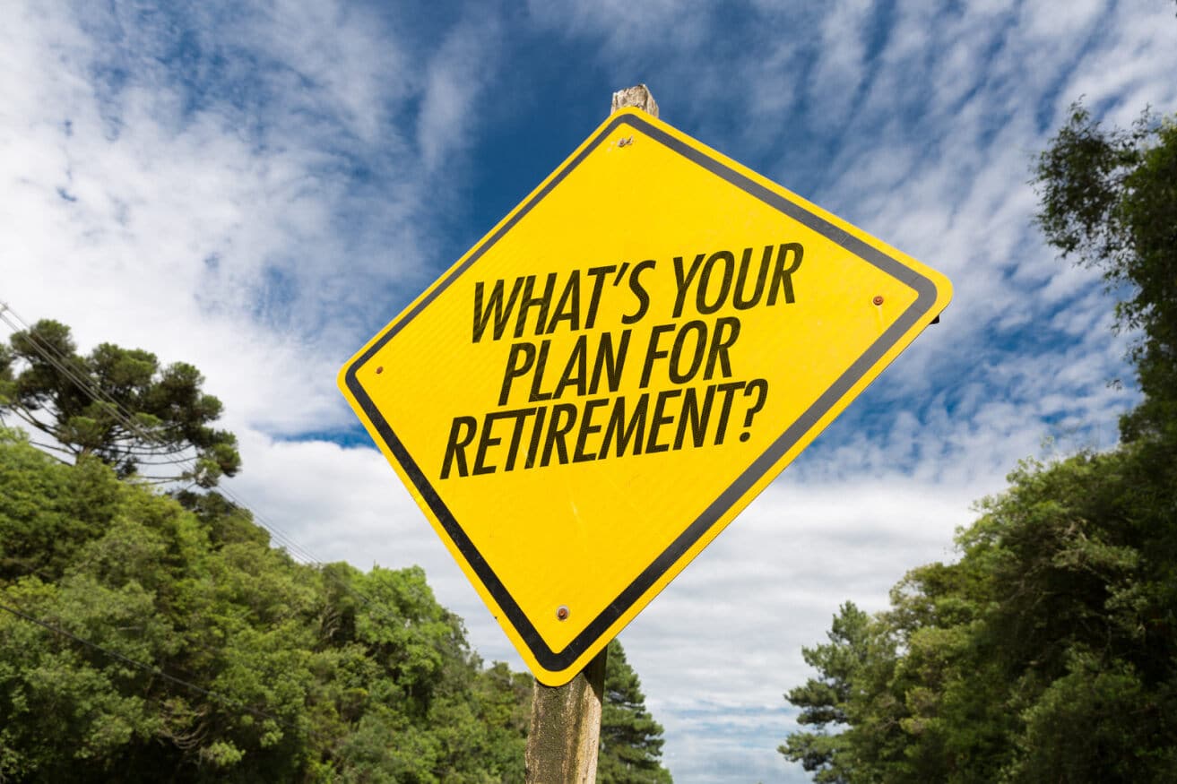 Retirement plan question on yellow road sign outdoors